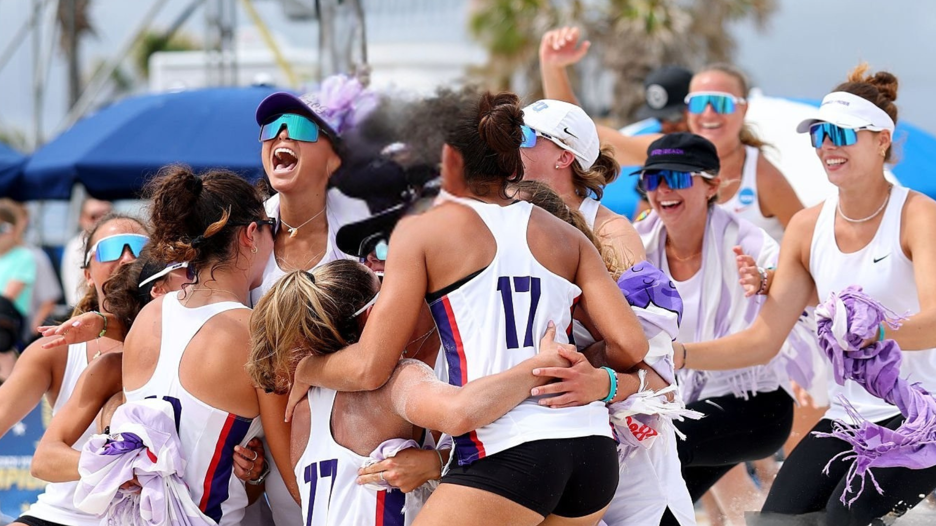 tcu national champions beach volleyabll ncaa d1 college recruiting advisory salava volleyball scholarship hector gutierrez TCU horned frogs players jumping with joy after winning the NCAA beach volleyball game.